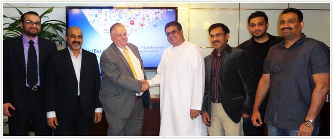 Mr Aboobacker Mohammed Ali shaking hands with Dr Paul Oquist
