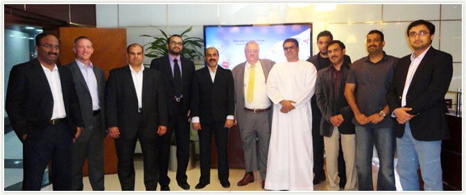 Mr Aboobacker Mohammed Ali and members of the Pride Holding team with Dr Paul Oquist